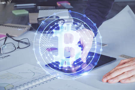 Double exposure of mans hands holding and using a phone and crypto currency blockchain theme drawing.の写真素材