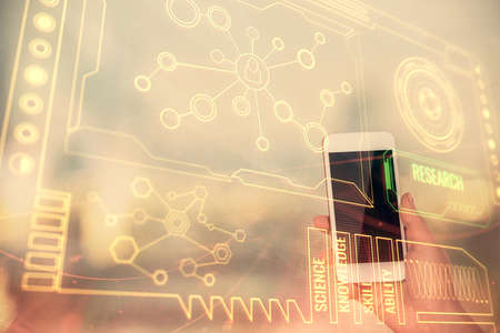Double exposure of technology sketch hologram and woman holding and using a mobile device.