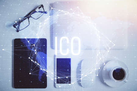 Double exposure of blockchain theme hologram over table with phone. Top view. Crypto technology...