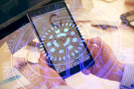 Multi exposure of mans hands holding and using a digital device and data theme drawing. Innovation...
