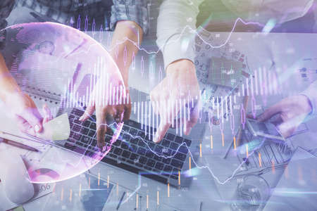Double exposure of man and woman working together and forex graph hologram drawing. Financial...