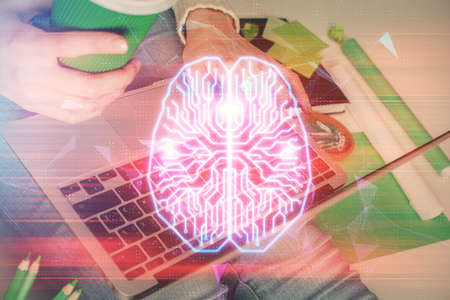 Double exposure of woman hands working on computer and brain hologram drawing. Ai concept.