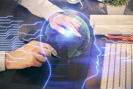 Double exposure of mans hand holding and using a digital device and brain hologram drawing. Data...