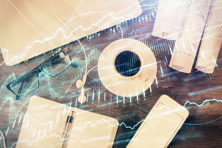 Multi exposure of forex graph drawing over desktop background with computer. Concept of financial...