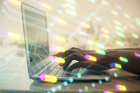 Double exposure of woman hands working on computer and data theme hologram drawing. Tech concept.
