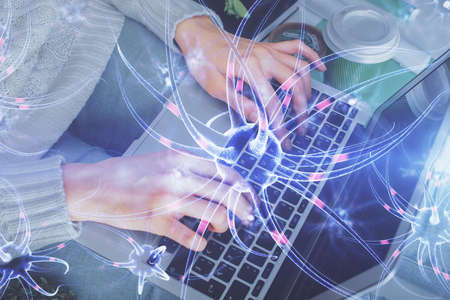 Double exposure of woman hands typing on computer and neuron drawing. Education concept.