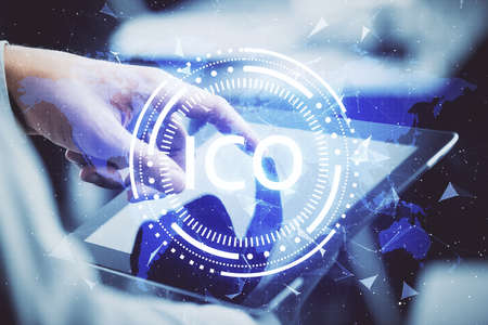 Double exposure of mans hands holding and using a phone and crypto currency blockchain theme drawing.の写真素材