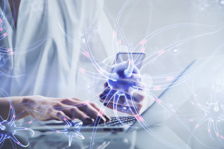 Double exposure of neuron sketch hologram and woman holding and using a mobile device. Education concept.の写真素材