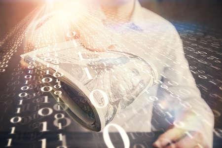 Double exposure of technology drawing hologram and us dollars bills and man hands. Data concept