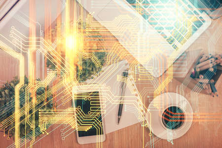 Double exposure of map hologram drawing over desktop. Top view. International connection concept.