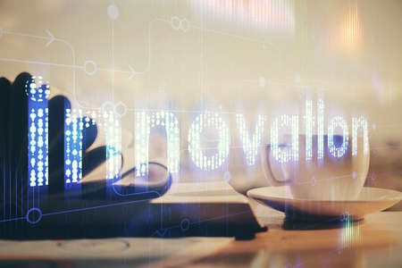 Double exposure of technology theme drawing and desktop with coffee and items on table background. Concept of data research.の写真素材