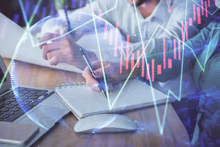 Double exposure of forex chart drawing over people taking notes background. Concept of financial...