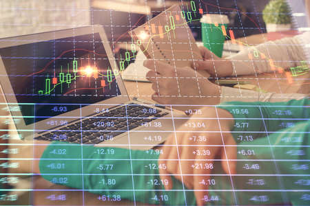 Double exposure of man and woman working together and forex chart hologram. Business concept....