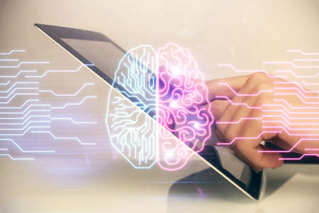 Double exposure of man's hand holding and using a digital device and brain hologram drawing. Data...