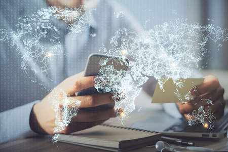 Double exposure of man's hands holding and using a phone and social network theme drawing.