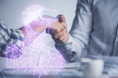 Double exposure of VR glasses drawings hologram and handshake of two men. Partnership concept.の写真素材