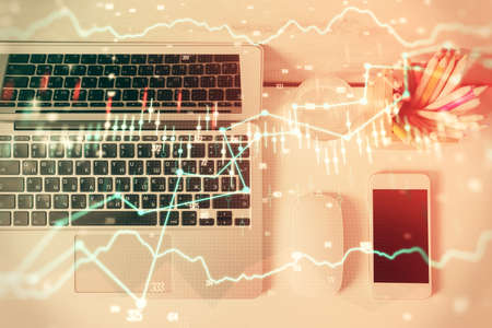 Multi exposure of forex graph drawing over desktop background with computer. Concept of financial...