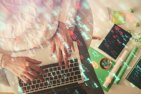 Double exposure of woman hands working on computer and data theme hologram drawing. Top View....