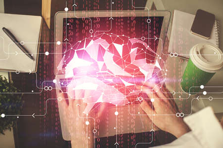 Double exposure of woman hands working on computer and brain hologram drawing. Ai concept.