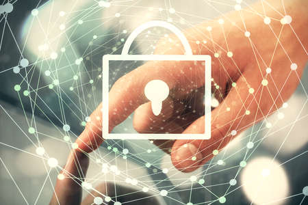 Multi exposure of man's hands holding and using a digital device and lock drawing. Security concept.の写真素材