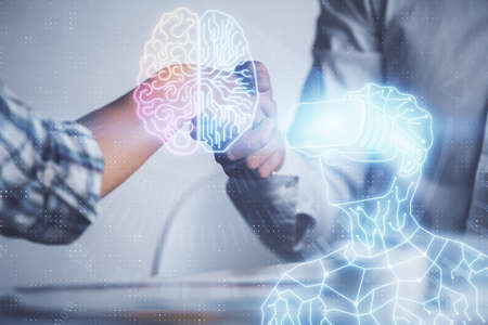 Double exposure of VR glasses drawings hologram and handshake of two men. Partnership concept.