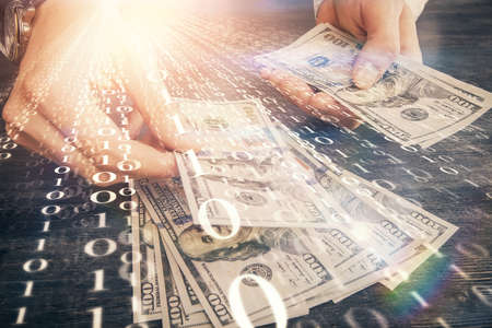 Double exposure of technology drawing hologram and us dollars bills and man hands. Data conceptの写真素材