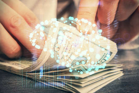 Multi exposure of brain drawing hologram and us dollars bills and man hands. Ai invest conceptの写真素材