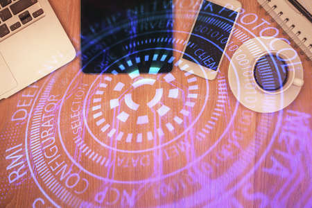 Double exposure of technology theme drawing over work table desktop. Top view. Global data analysis concept.の写真素材