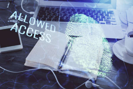 Double exposure of finger print drawing and desk with open notebook background. Concept of security