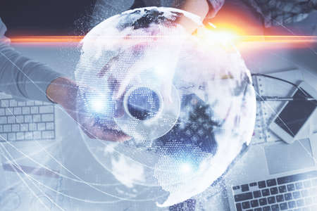 Double exposure of man and woman working together and business theme hologram drawing. Computer...