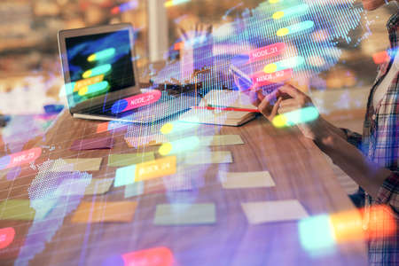 Multi exposure of woman hands working on computer and data theme hologram drawing. Tech concept.