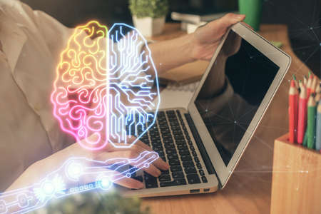 Double exposure of woman hands working on computer and brain hologram drawing. Ai concept.の写真素材