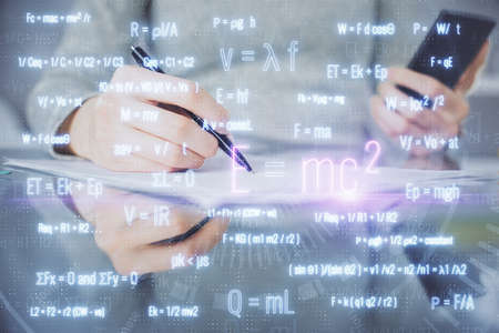 Double exposure of formulas sketch hologram and woman holding and using a mobile device. Education...