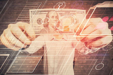 Double exposure of technology drawing hologram and us dollars bills and man hands. Data concept