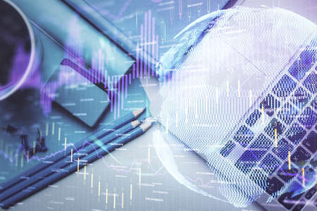 Double exposure of forex graph drawing over desktop background with computer. Concept of financial...