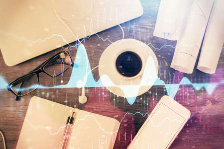 Multi exposure of forex graph drawing over desktop background with computer. Concept of financial...