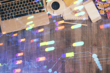 Multi exposure of data theme drawing hologram over topview work desk background with computer....
