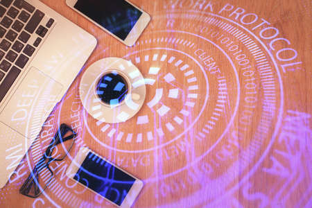 Double exposure of technology theme drawing over work table desktop. Top view. Global data analysis concept.の写真素材