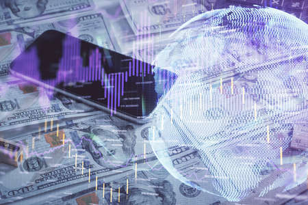 Double exposure of forex graph drawing over us dollars bill background. Concept of financial...