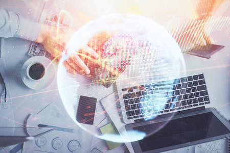 Double exposure of man and woman working together and business theme hologram drawing. Computer...