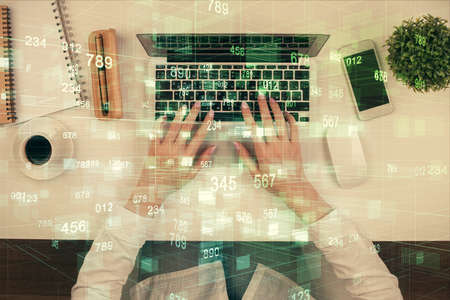 Double exposure of woman hands working on computer and data theme hologram drawing. Top View....
