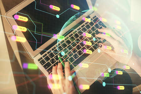 Double exposure of woman hands working on computer and world map hologram drawing. Top View....