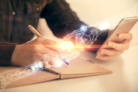 Double exposure of technology sketch hologram and woman holding and using a mobile device.