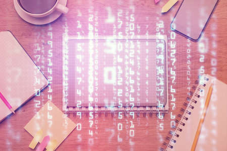 Double exposure of technology theme drawing over work table desktop. Top view. Global data analysis concept.の写真素材