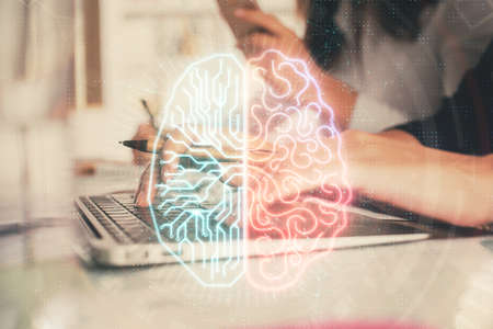 Multi exposure of woman hands working on computer and brain hologram drawing. Ai concept.の写真素材