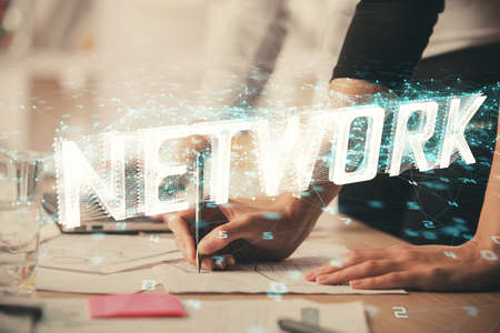 Double exposure of woman hands working on computer and data theme hologram drawing. Tech concept.