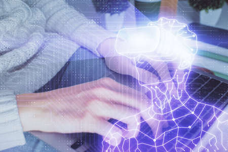 Double exposure of woman hands typing on computer and man in AR glasses drawing. Education concept.