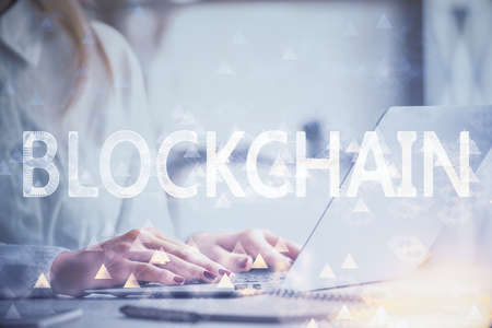 Double exposure of woman hands typing on computer and crypto market theme hologram drawing....