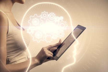 Double exposure of brain sketch hologram and woman holding and using a mobile device.
