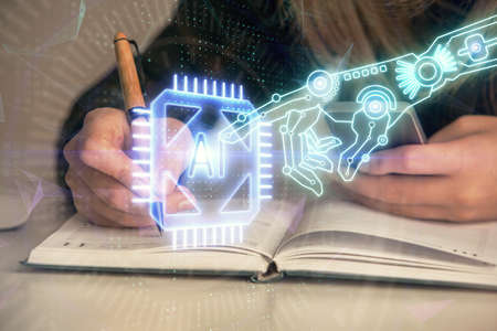 Multi exposure of woman hands working on computer and data theme hologram drawing. Tech concept.の写真素材